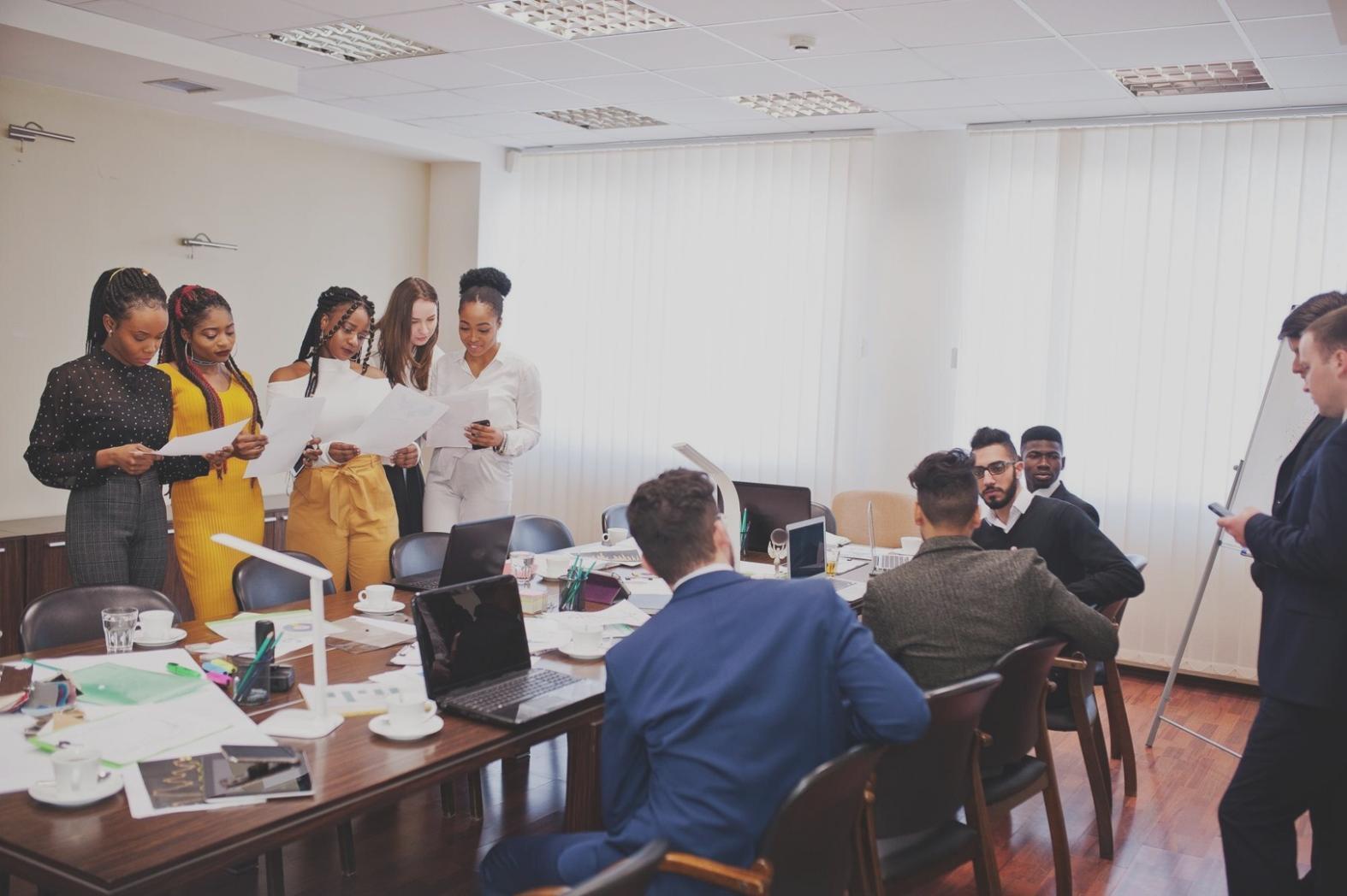 Person reviewing financial documents and charts
